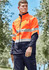 A unisex hi-vis softshell jacket in bright orange and navy, featuring reflective stripes and a logo on the chest.
