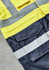 A bright yellow and dark navy jacket featuring reflective strips and multiple pockets, with a logo present.