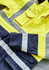 A high-visibility yellow and navy jacket featuring reflective strips and a brand logo.