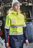 A women's hi-vis ultralite waterproof jacket in bright yellow and navy, featuring reflective stripes and a hood.