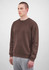 A brown men's crew sweatshirt on a model, featuring long sleeves and a relaxed fit.