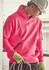 A bright pink unisex water-resistant hoodie with a front pocket and a logo, worn by a person with a hard hat and gloves.