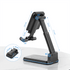 A foldable wireless charge stand in black, featuring adjustable angles and dimensions for convenience. It has a logo.