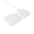 A white magnetic wireless charger with two charging pads and a connecting cable. It features a simple, sleek design.