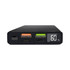 A black wireless power bank featuring USB ports, a digital display, and a textured surface.
