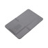 A grey credit card-sized flash drive with a built-in connector, featuring a minimalistic design.