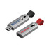 A silver flash drive with a black and red strap, featuring branding on both sides.
