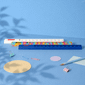 A 30cm popper ruler in blue with a colourful design, surrounded by stationery items like paperclips and circular paper.