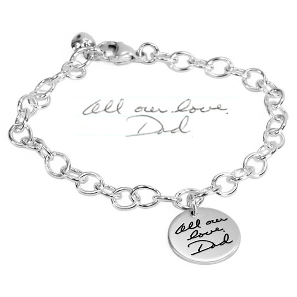 Custom Silver memorial Handwriting Bracelet with Dad's handwriting, shown with original handwritten note used to personalize it, on white