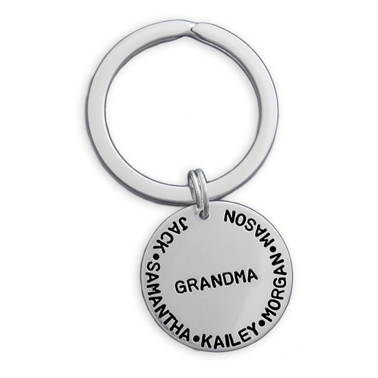Silver custom hand stamped key ring for grandma with grandkids' names, shown on white
