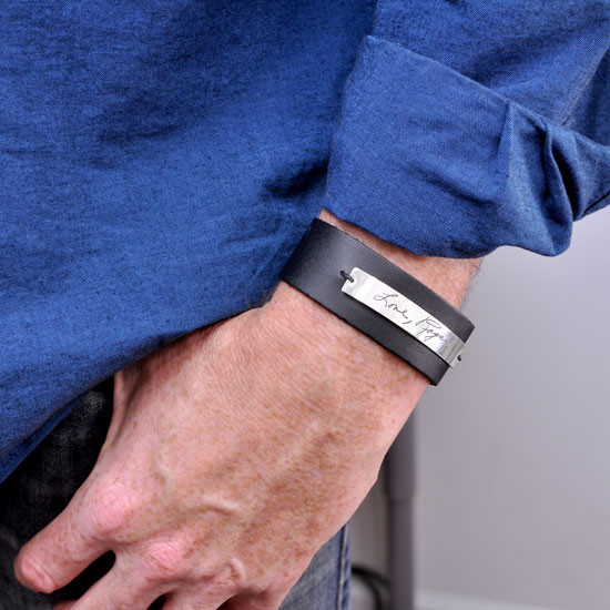 Custom handwriting leather bracelet, shown on model with the actual handwriting etched on silver