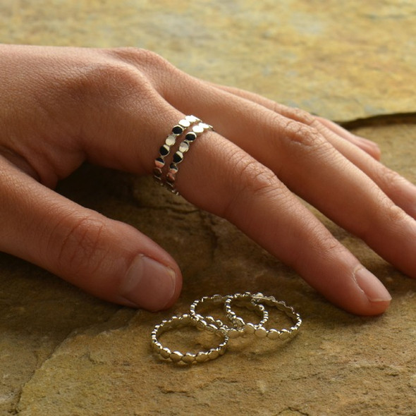 Sterling silver circles stacking ring on person