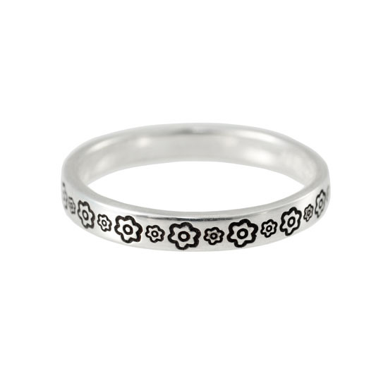 Stackable silver ring stamped with flowers