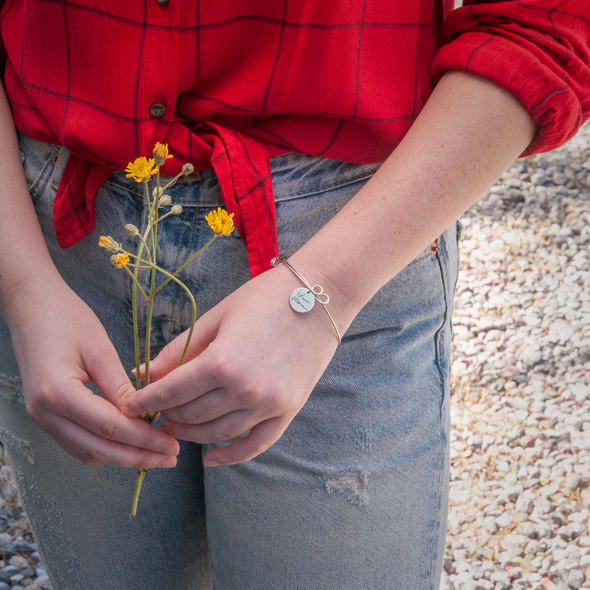 Custom handwriting signature silver bracelet with kids names, shown on a model