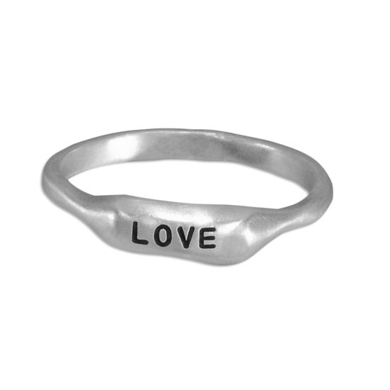 Sculpted silver bar ring, hand stamped with the word Love shown on white background