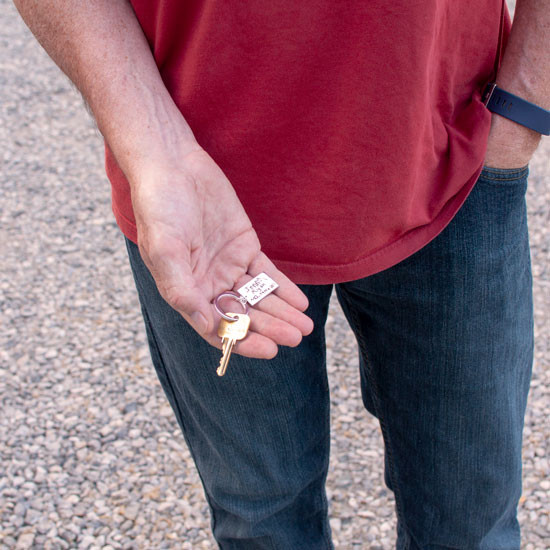 Silver key chain with your actual handwriting showing kids' handwriting, shown in hand