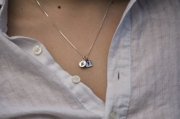 Child's footprints on a necklace