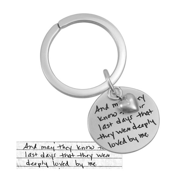 Custom handwriting sterling silver key chain, shown with original handwritten note used to personalize it, shown close up on white