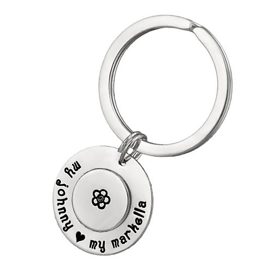 Custom Large Double Disc Key Ring in sterling silver, stamped with names and symbols, shown on white