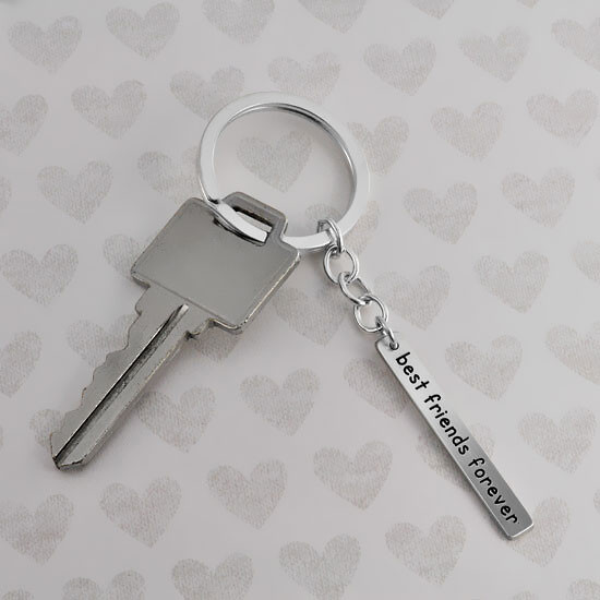 Custom silver Your Saying Key Ring, personalized with special message to best friend, shown with a key
