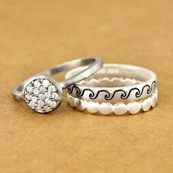 Sterling silver circles stacking ring, shown with some other of our stacking rings