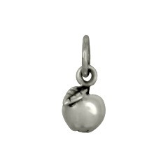 Tiny sterling silver apple charm for teachers, side shown close up on white