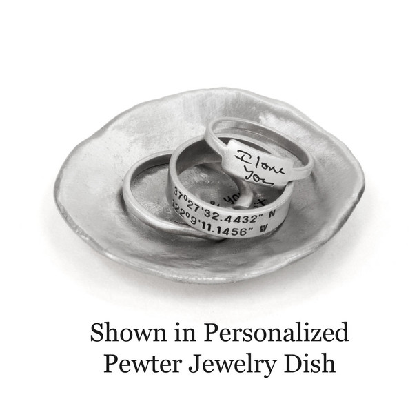 Sterling silver ring with hand stamped coordinates, shown in a personalized pewter jewelry dish
