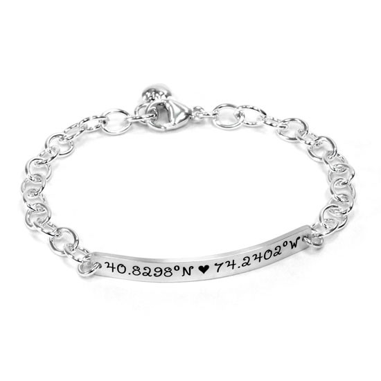 Silver personalized hand stamped coordinates bracelet, with custom location, shown on white
