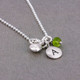 Silver Tiny Round Initial Charm necklace, shown close up from the side