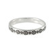 Stackable silver ring stamped with flowers