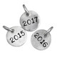 Hand stamped silver year charm for teachers & grads shown on white