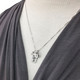 Model wearing custom fine silver Family Tree necklace, personalized with hand stamped kids' initials, hung with pearl charm