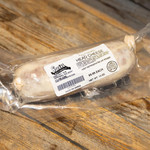 Schwartenmagen Head Cheese - 14oz, fully cooked head cheese in vacuum-sealed packaging on a wooden surface.