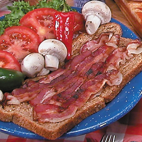 Hickory Smoked Uncured Bacon - 1lb Package, crispy bacon slices on whole grain toast with fresh vegetables and mushrooms.