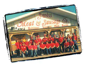 Swiss Meats employees in front of the Swiss Meat & Sausage Company store