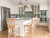 Timeless blue and white kitchen with center island, wood floors, and wood dining chairs