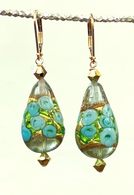 Light teal swirled roses on  gold foil flattened tear drop Venetian glass earrings