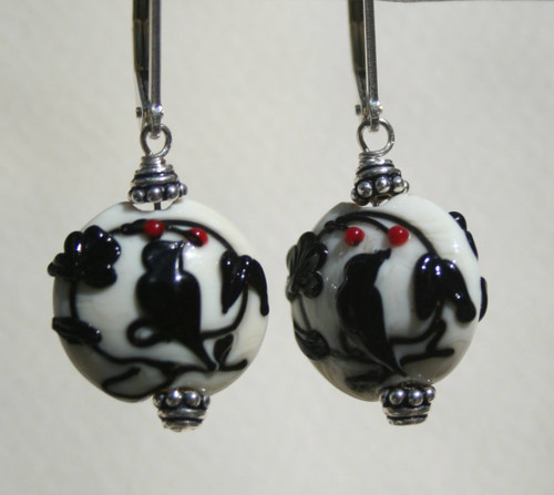 Black dove lampworked lentil shaped earrings