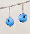 Soaring bird in arctic blue sky lampworked lentil earrings