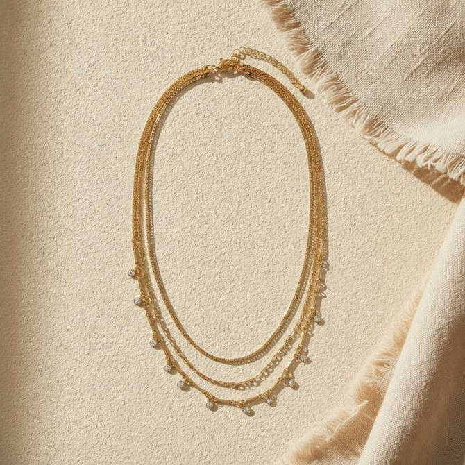 GOLD LAYERED NECKLACE WITH SHIMMERING CRYSTAL CHARMS