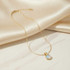 GOLD SNAKE CHAIN NECKLACE WITH ROUND MOTHER OF PEARL PENDANT