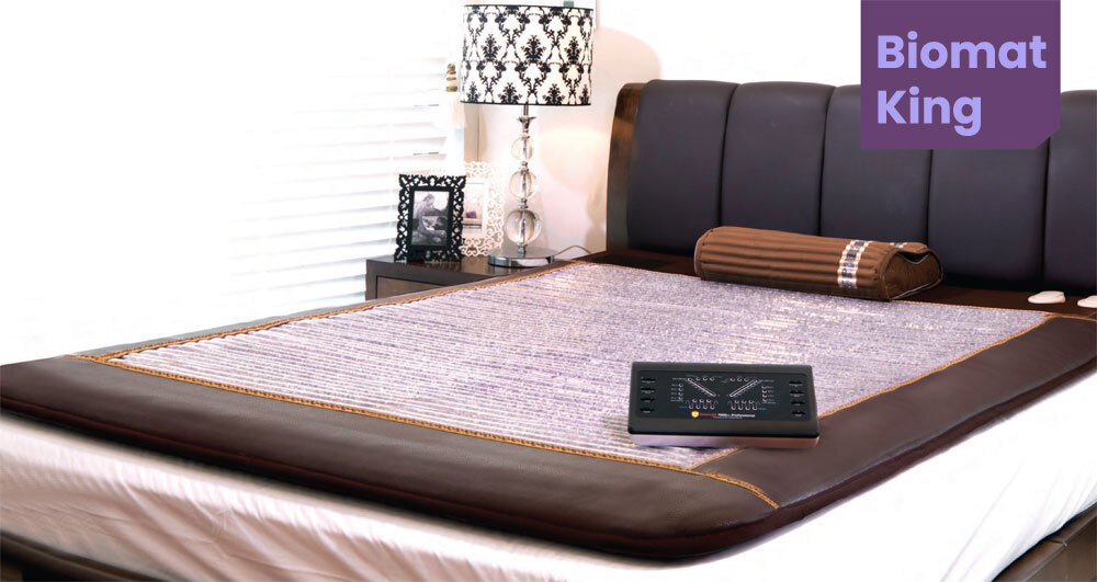 King Biomat on top of bed in bedroom