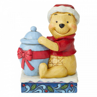 Disney Traditions Winnie the Pooh with a tub full of honey as his Christmas gift figurine