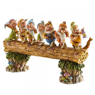 Disney Traditions All Seven Dwarfs from Snow White on a log figurine
