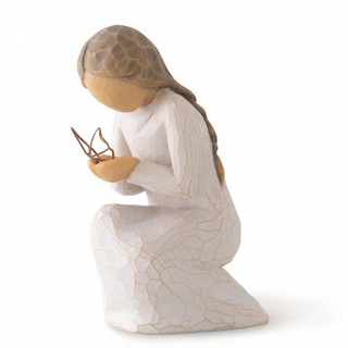 Willow Tree Quiet Wonder Figurine depicting a girl holding a wire butterfly