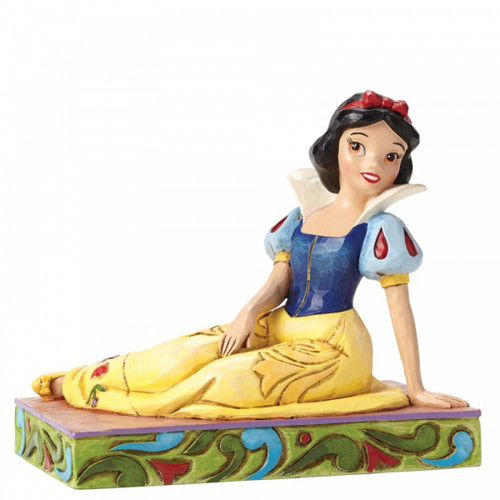 Disney Traditions Snow White in a relaxed seated pose Figurine