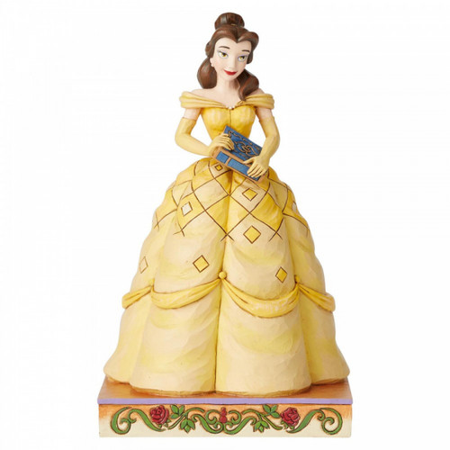 Disney Traditions Belle from Beauty and the Beast wears her classic yellow gown and holds a book in her hands figurine