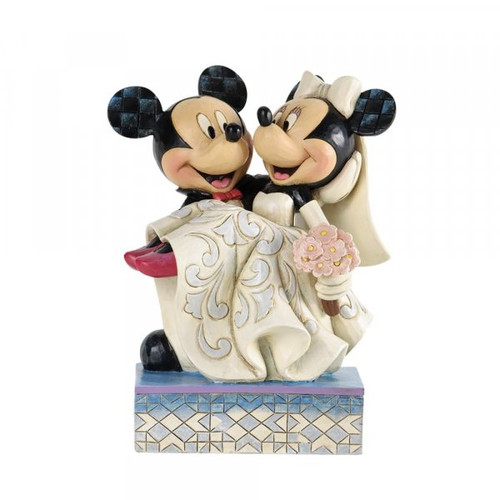 Disney Traditions Mickey carries Minnie, both wearing their wedding outfits figurine