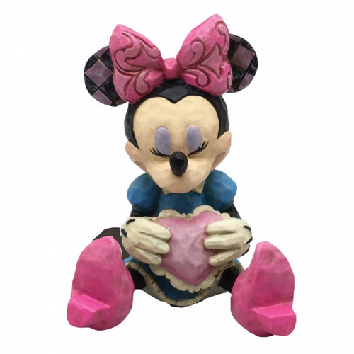 Disney Traditions Minnie Mouse sits with a heart mini figurine