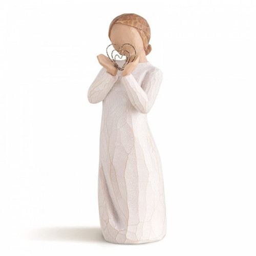 Willow Tree Lots of Love Figurine showing a girl holding a sparkling heart